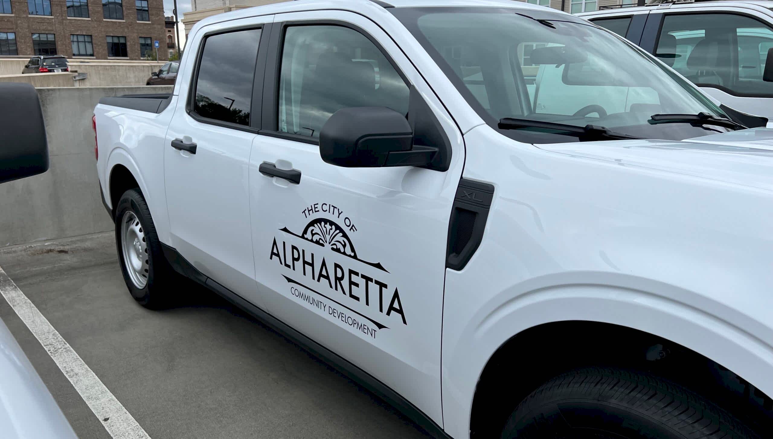 City of Alpharetta community development partial wraps and vinyl lettering for advertising on cars in Georgia