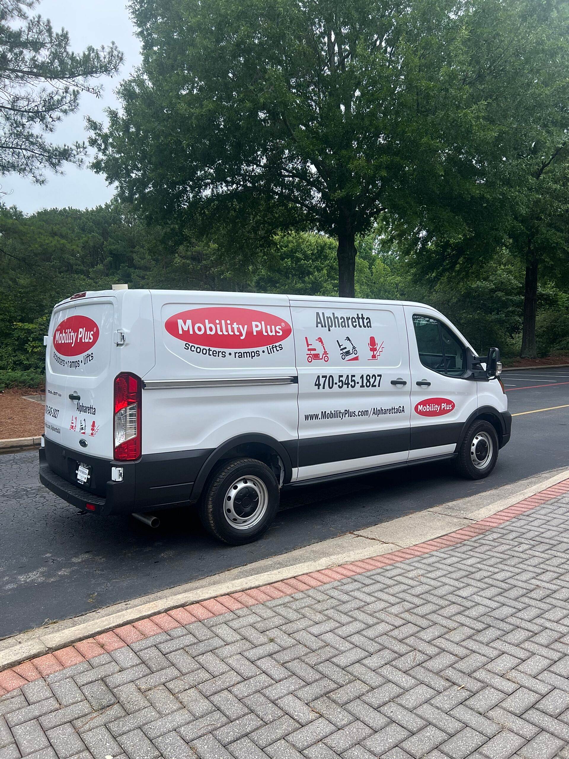 mobility plus Spot Graphics and Partial Wrap on a Ford Transit 150 van with custom Vinyl Lettering