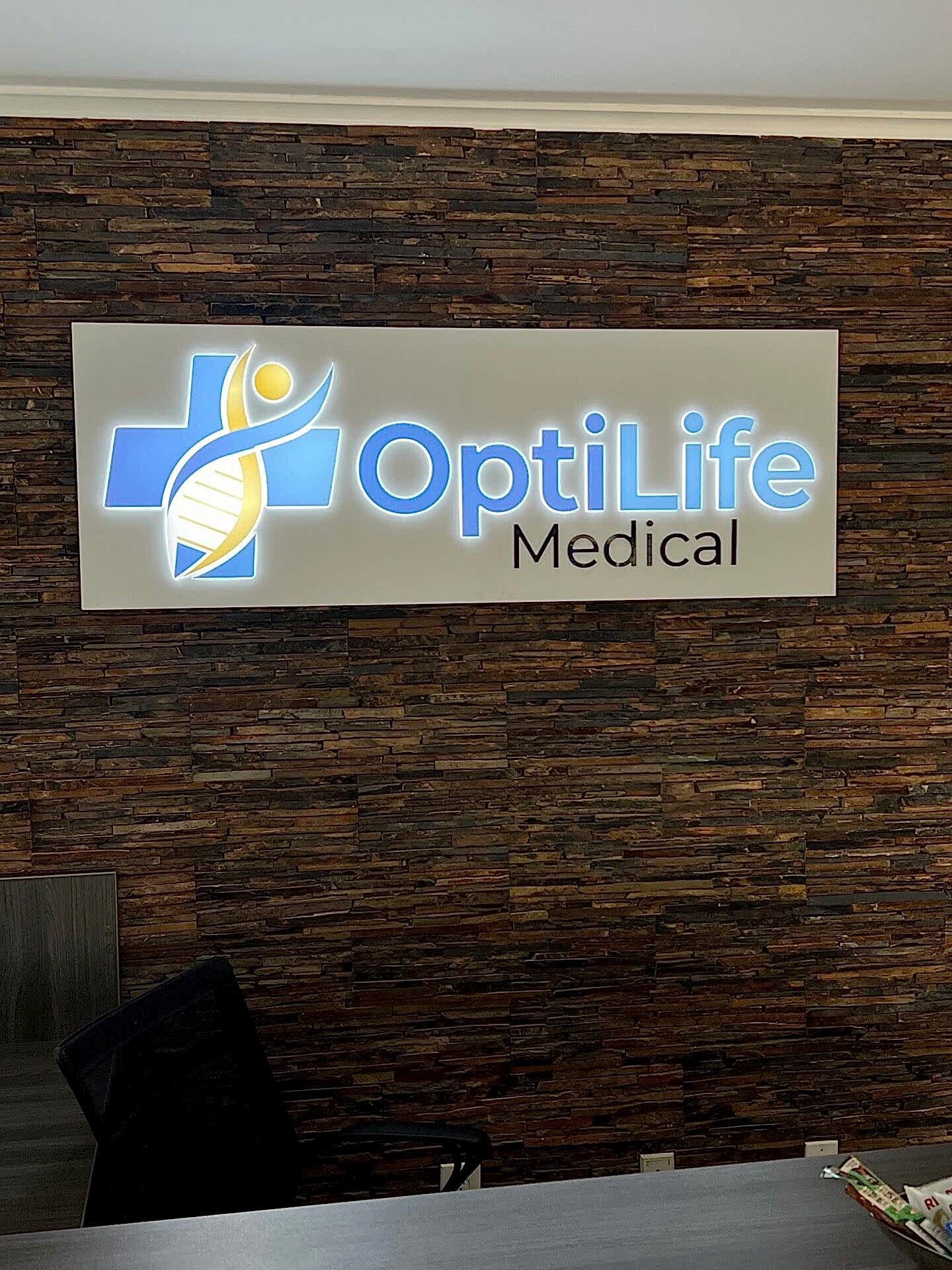 LED illuminated lobby sign for OptiLife Medical in Roswell, GA, featuring push-through acrylic letters and a clean, modern design.