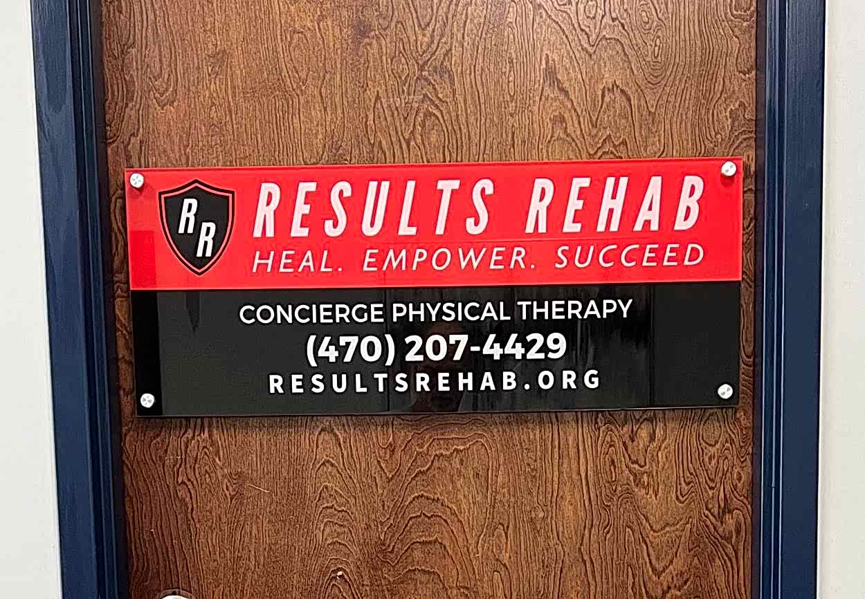 Acrylic office sign for Results Rehab featuring clean, modern lettering, mounted on an interior wall for a polished, professional look.