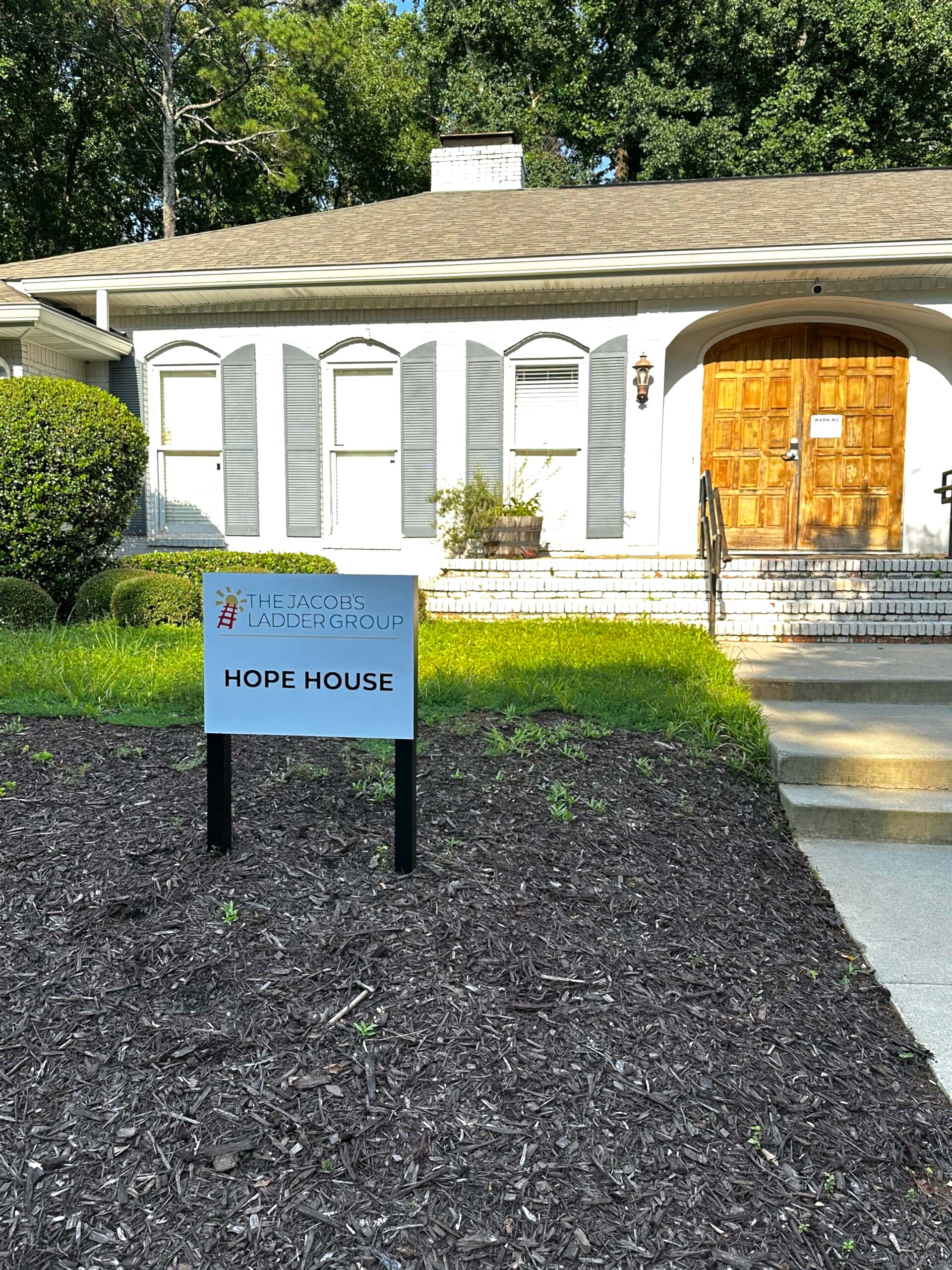 Updated wayfinding sign for The Jacob’s Ladder Group featuring new vinyl graphics that reflect the organization’s refreshed branding