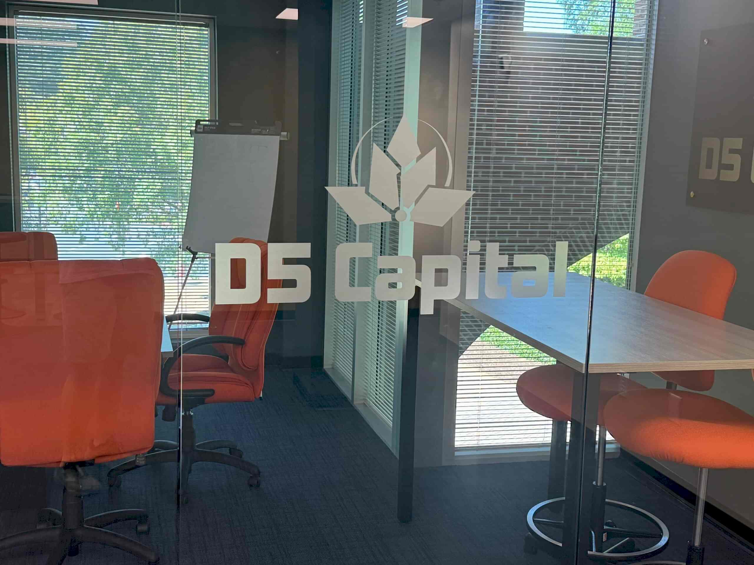 Custom D5 Capital door graphics in Alpharetta, GA, featuring the company logo and name applied to glass conference room doors.